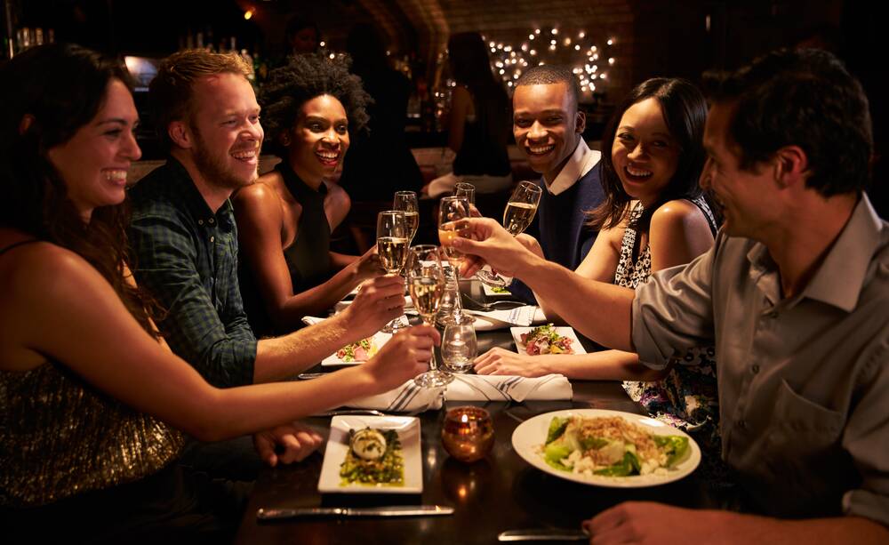 Scenes like this have been out of the question during the COVID outbreak, but only people who have been twice jabbed will be able to attend a restaurant when the state reaches 70 per cent double-dose vaccination. Photo: SHUTTERSTOCK