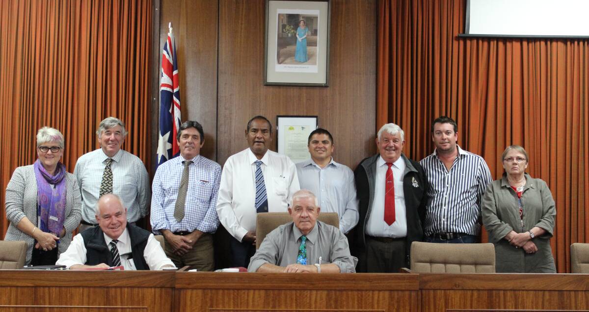 Cr Ian Woodcock takes the chair as mayor of the Walgett Shire, surrounded by fellow councillors (standing) and general manager Don Ramsland (sitting left). Photo contributed. 