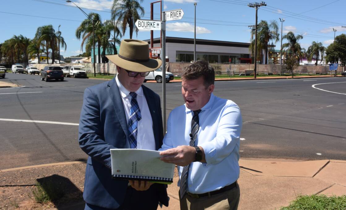 Transport for NSW acting western director Alistair Lunn and Dubbo MP Dugald Saunders along the route of the planned River Street bridge with the submissions report in February. Photo: FAYE WHEELER