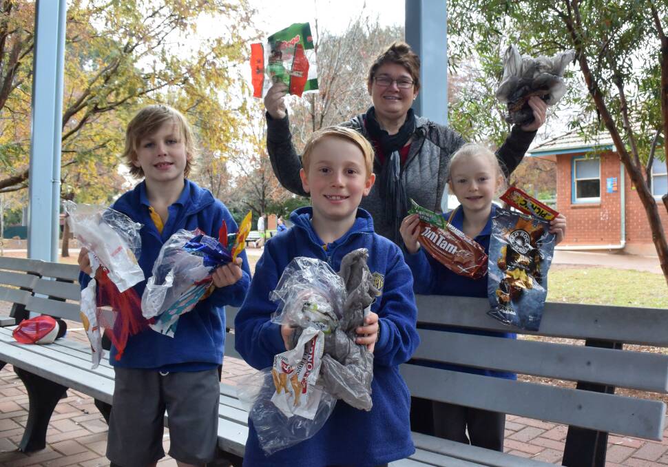Warriors: Students Angus Etcell, Jack Gray and Mia Cudmore and teacher Alexandra Prince with plastics that can be recycled at major supermarkets. Photo: FAYE WHEELER