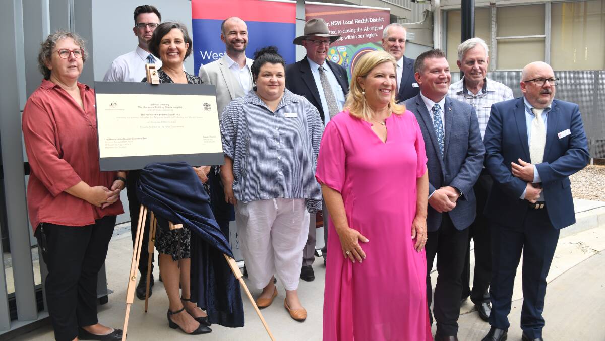 (Front in pink) Minister for Regional Health Bronnie Taylor at the official opening of the Macquarie Building. Picture: AMY MCINTYRE