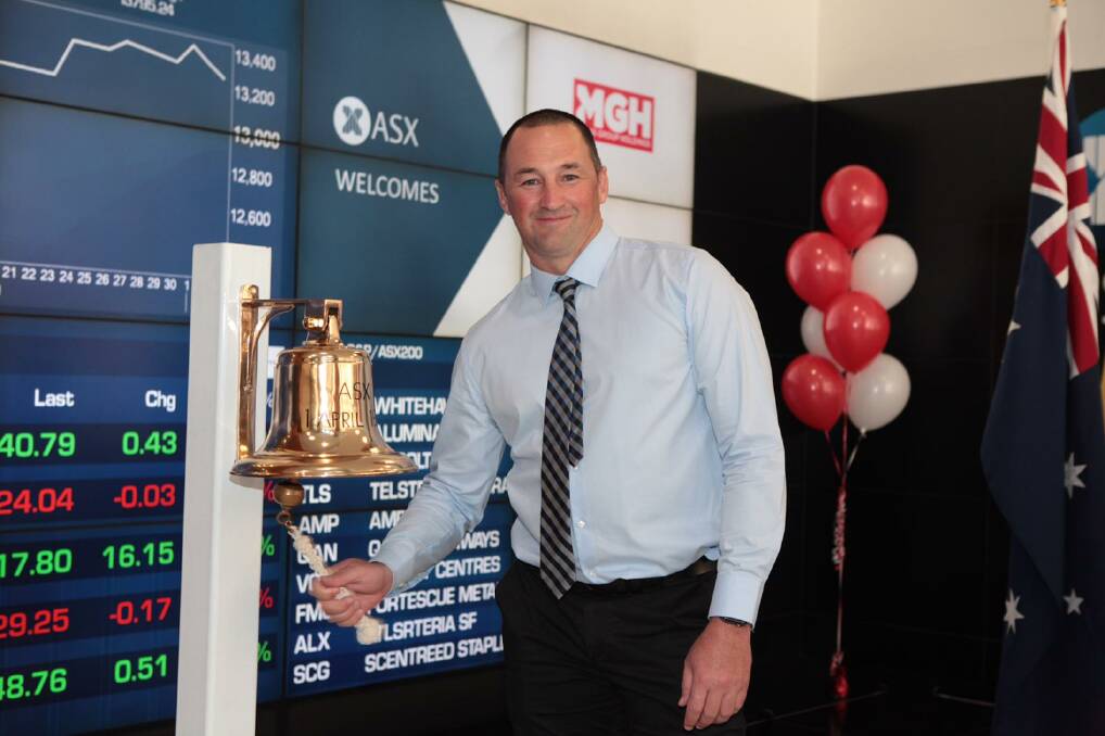Milestone: Maas Group Holdings chief executive officer Wes Maas rings the bell at the Australian Securities Exchange in Sydney to mark the start of the company's shares trading on the market. Photo contributed. 
