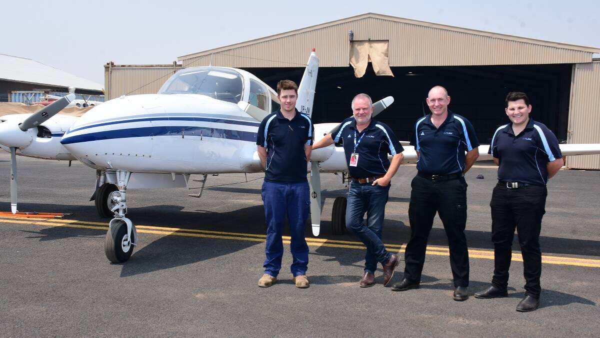 New era: Air Link aircraft maintenance engineer Ryan Riley, general manager Ron O'Brien, and pilots Paul Lane and Matt Williams with a Cessna 310. Air Link will use Piper Chieftain aircraft for the new air services. Photo: BELINDA SOOLE