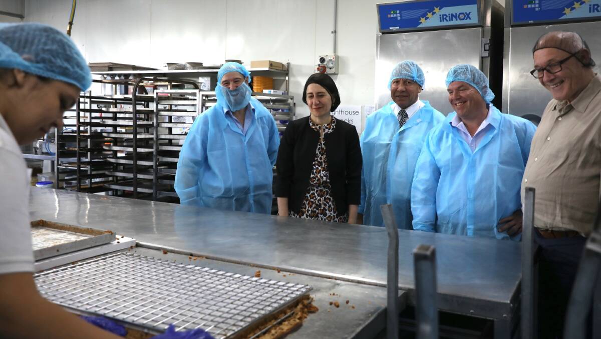 Earlyrise managing director Robert Stevenson, Premier Gladys Berejiklian, Dreamtime Tukas Herb Smith, Dubbo MP Dugald Saunders and small business minister Damien Tudehope during a visit to Earlyrise in 2019. Photo contributed.