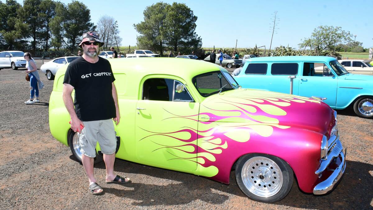 Greg Carlton with his restored and shiny vehicle. Photo: AMY MCINTYRE