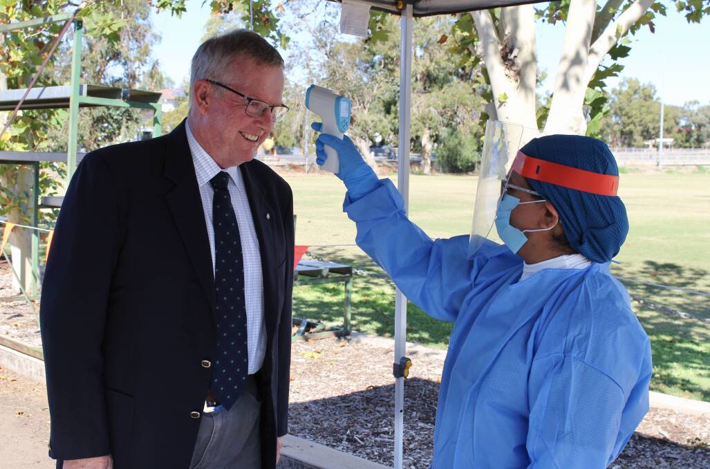 Parkes MP and Minister for Regional Health Mark Coulton has his temperature checked. Photo contributed.
