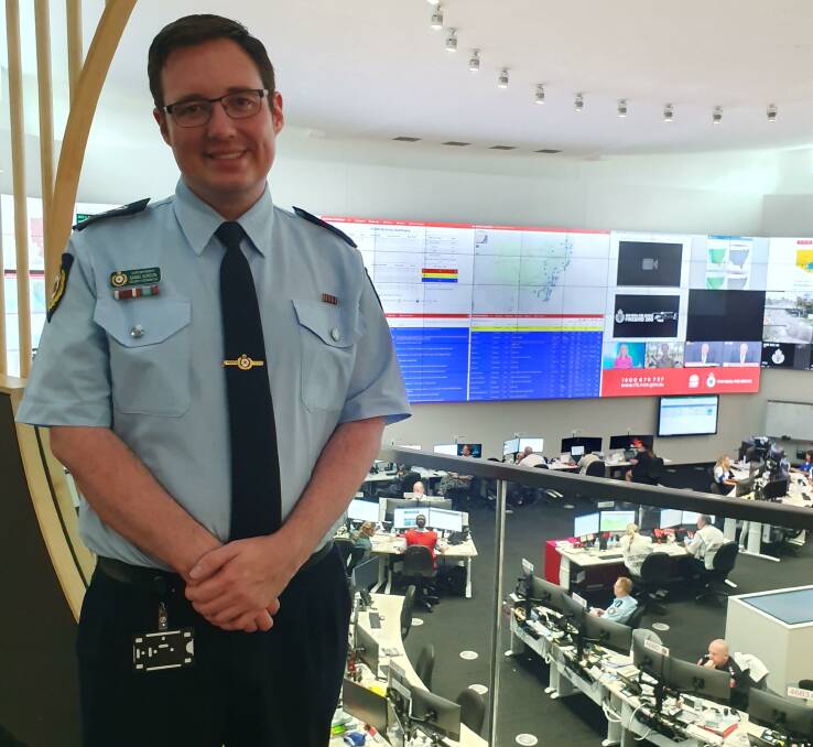 Daniel Gordon working as a sheriffs liaison officer to the RFS during the bushfires as part of Operation RFS Assist at RFS state operations. Photo contributed.