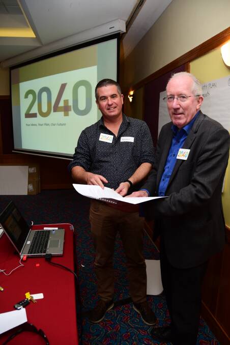 In the mix: Place-maker Andrew Hammonds and Dubbo Regional Council administrator Michael Kneipp talk ideas for the future at the draft 2040 plan summit on Sunday. Photo: BELINDA SOOLE