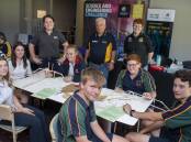 Fun: (front) Students Kaitlyn Hyde, Sarah Cain, Emily Roberts, Isaac Finlay, Lachlan Anderson, Oliver McDonald with (back) Inland Rail's Melissa Meadowcroft, Rotarian Howard Rutherfurd, UoN's Abby Hodges. Picture: BELINDA SOOLE