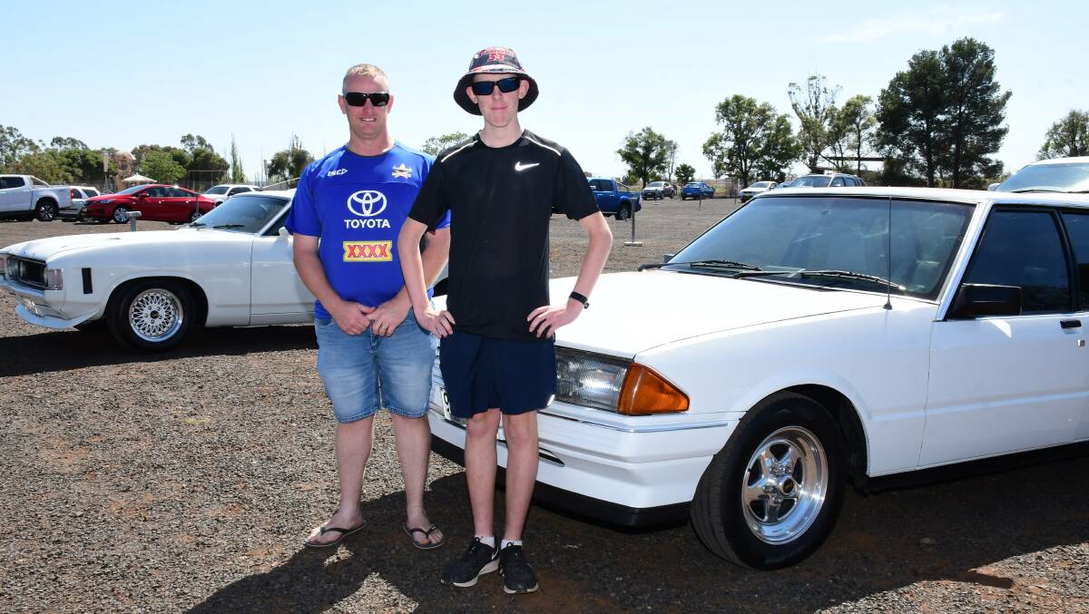 Greig Nicholls and son Blake Nicholls with their two cars they brought to Dubbo for the event. Photo: AMY MCINTYRE