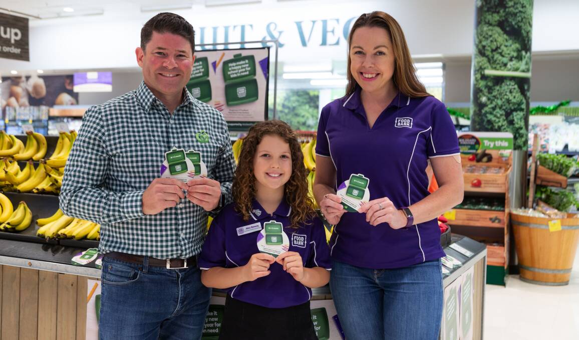 Simon from Woolworths, Foodbank youth ambassador Alice Ramsey and Foodbank Australia CEO Brianna Casey encourage customers to support the appeal. Photo contributed.