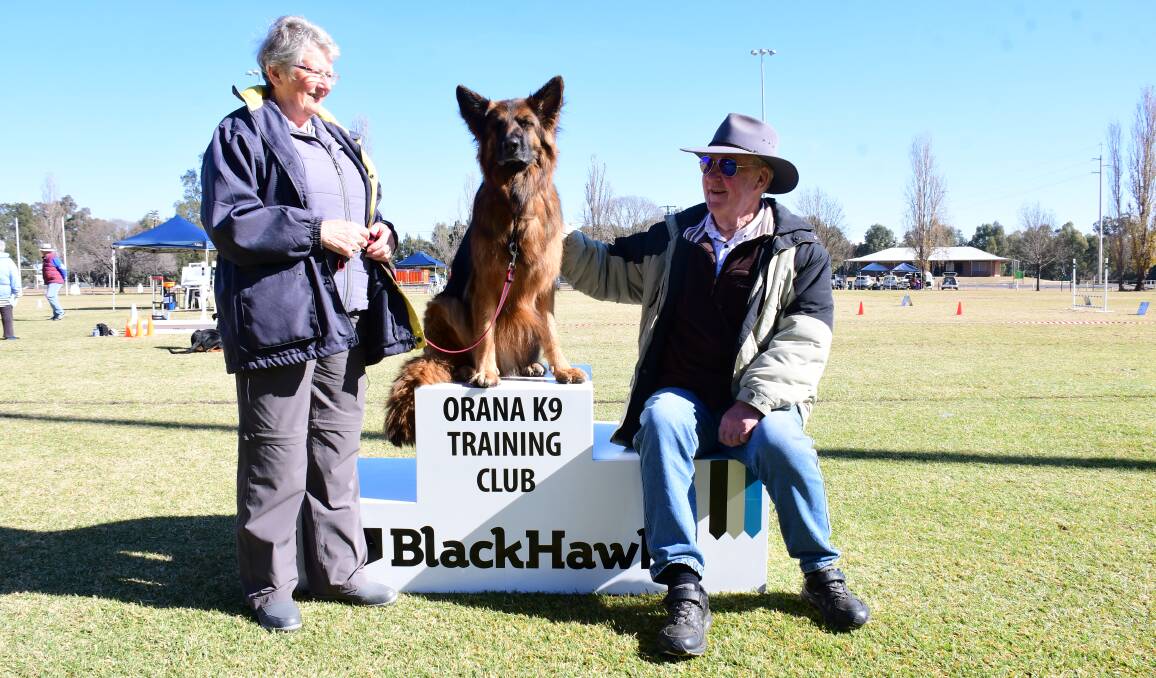 Prized: Ellie Kay with her dog, Scandal, and Orana K9 Training Club president Reg Parker at the Obedience and Rally O Trial. Photo: AMY MCINTYRE