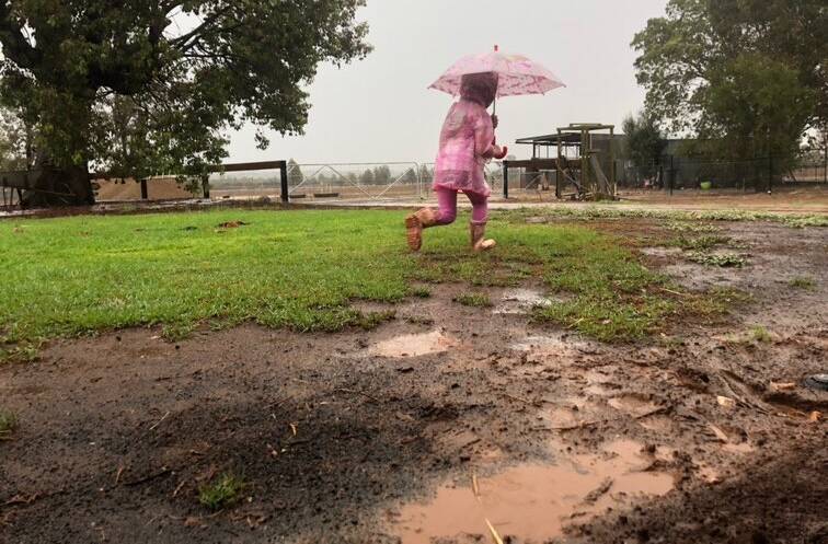 Mia Meek Houghton soaks up the rainy day experience. Photo contributed.