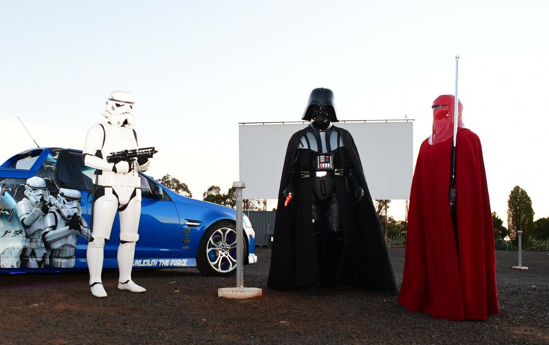 Fun hobby: (Centre) Rodney Cox dressed as his favourite character Darth Vader, with brother Tony Cox in a storm trooper costume and daughter Jessica Cox in an imperial guard costume, ahead of a Star Wars event at the drive-in in 2020. Photo: BELINDA SOOLE