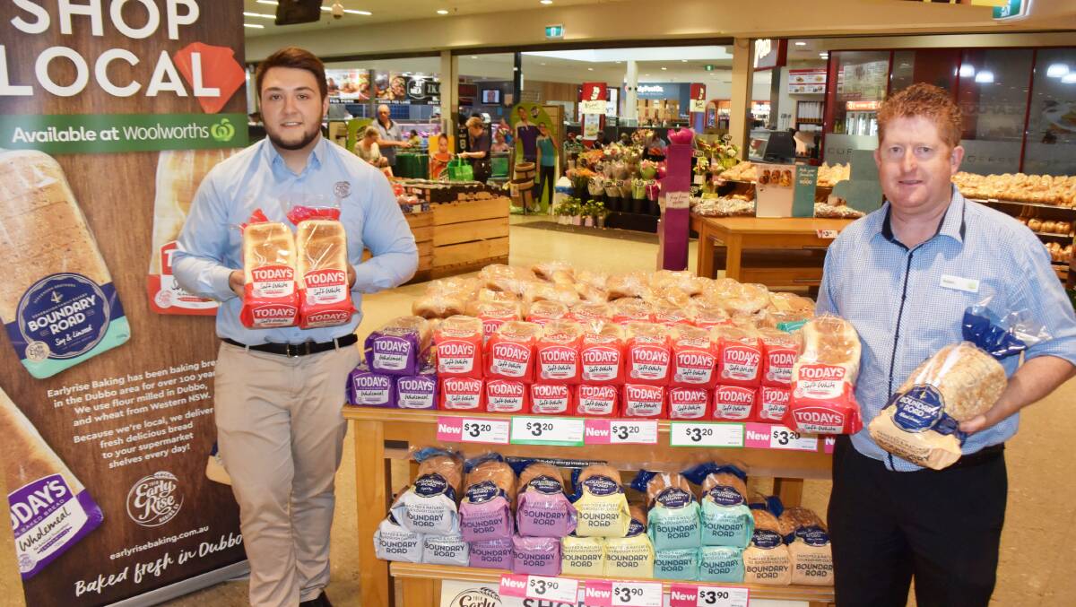 Early Rise Baking Co sales and distribution manager Beau Stevenson and Woolworths Orana Mall manager Adam Morrissey with the two local brands. Photo: FAYE WHEELER