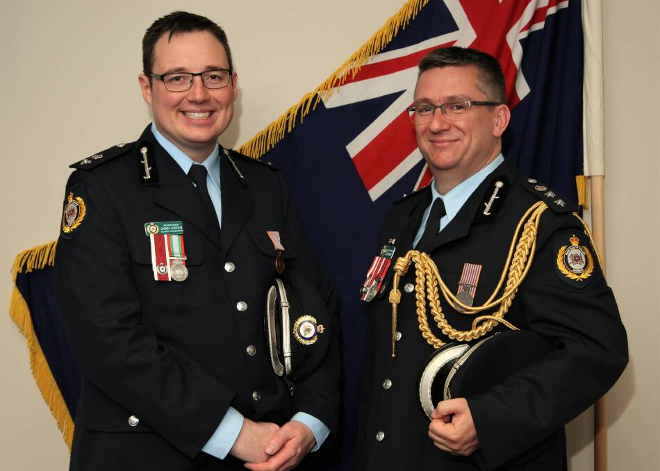 Soaring: Acting Chief Superintendent Daniel Gordon of the Office of the Sheriff of NSW, who grew up at Gilgandra, at a work ceremony with Assistant Sheriff Scott Mayer. Photo contributed.