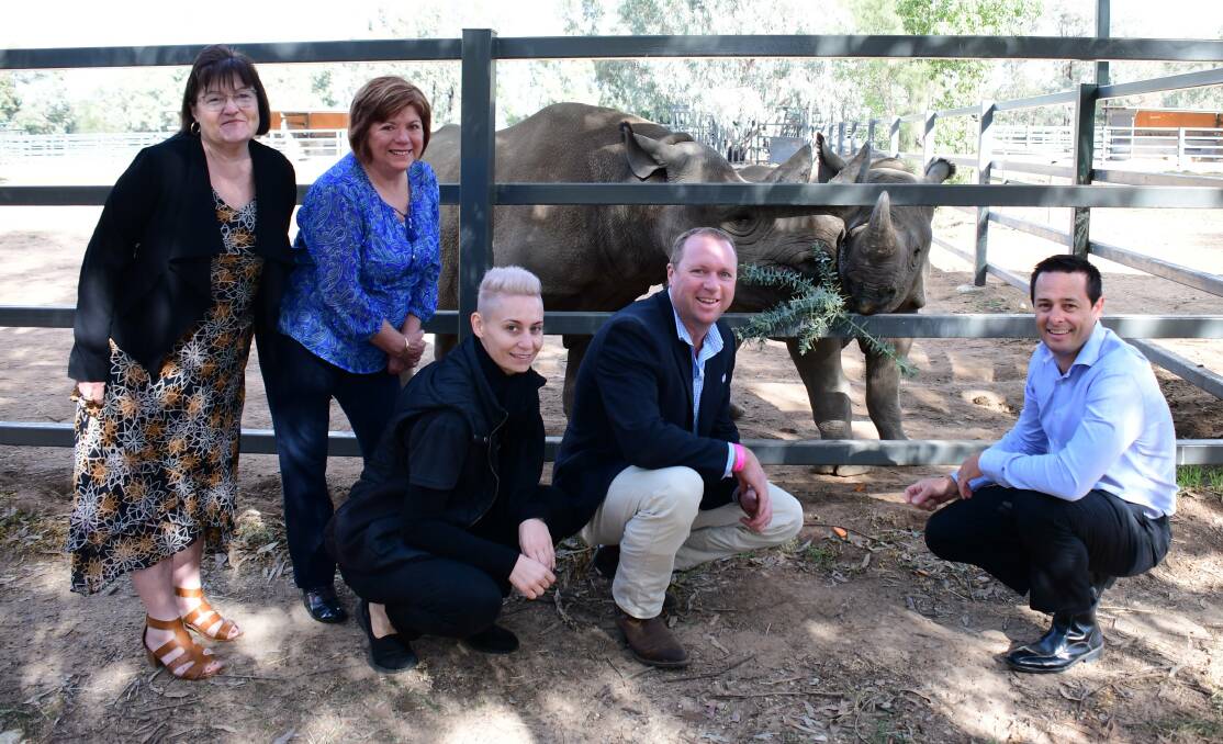 Countdown: Marilyn Brann, Toni Beatty, Kerrieanne Nichols, Ben Luck and Matt Wright launching the 2019 Rhino Awards with two of Taronga Western Plains Zoo's black rhinos. Photo: AMY McINTYRE