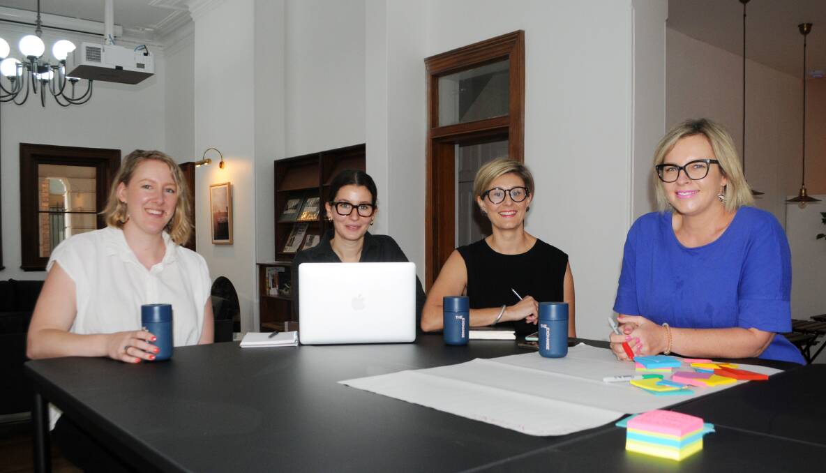 At work: Novelise founder Sarah Stanford, The Exchange community manager Minna Demetriou and project delivery manager Kate Wade, and LeaderLife founder Joh Leader. Photo: FAYE WHEELER