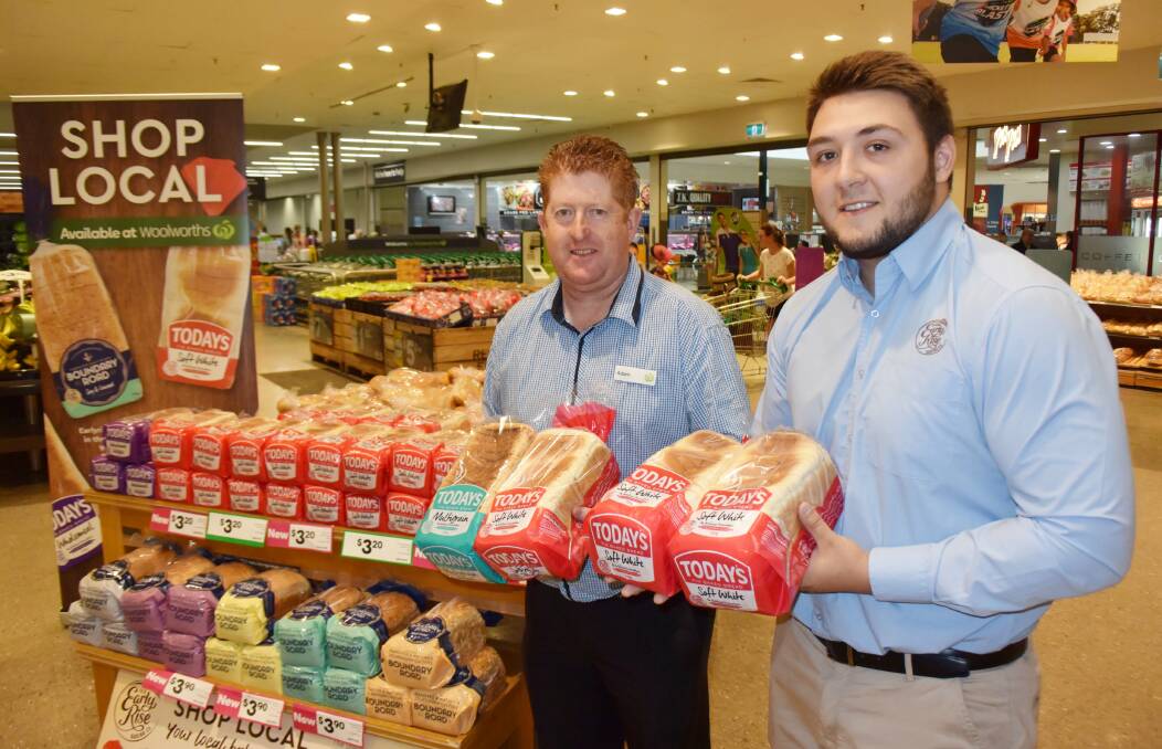 Shop local: Woolworths Orana Mall manager Adam Morrissey and Early Rise Baking Co sales and distribution manager Beau Stevenson with the bread made at Dubbo. Photo: FAYE WHEELER