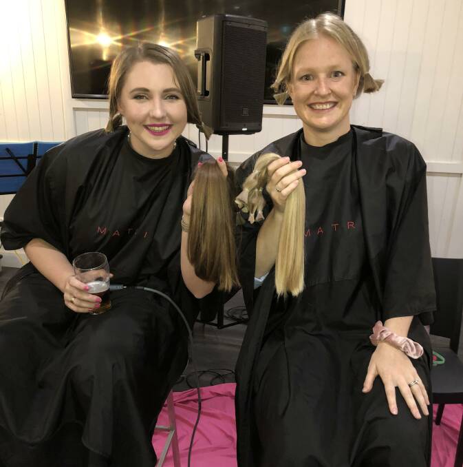 Cut: 2019 Dubbo Showgirl Tyla Comerford and 2017 Dubbo Showgirl Rose Broughton after having their hair chopped for charity. Photo contributed.