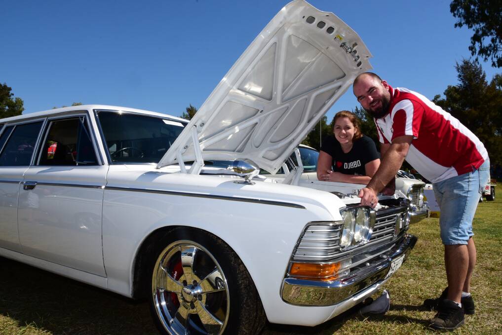 Oh what a feeling: Canberra Celica Group members Tristina and Grant Haines compete in the 41st annual Toyota Nationals show and shine at Ollie Robbins Oval. Photo: BELINDA SOOLE