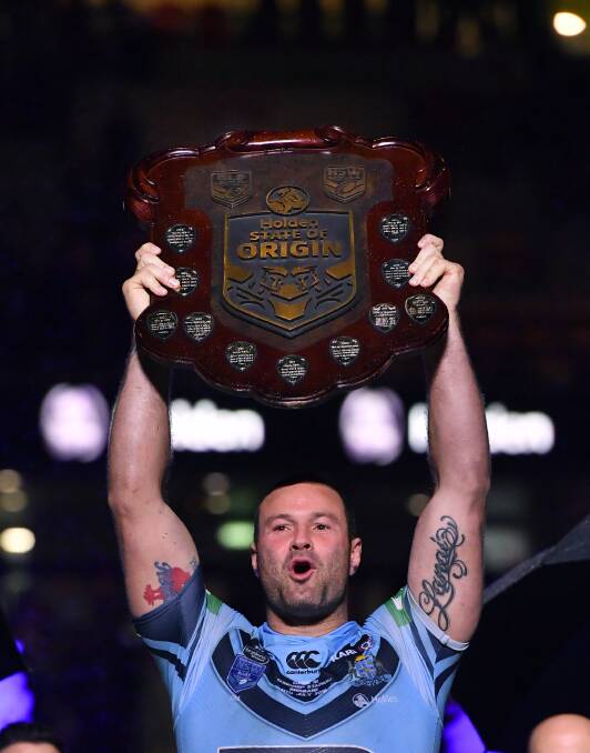 NSW captain Boyd Cordner celebrates winning the 2018 State of Origin series between the NSW Blues and the Queensland Maroons at Suncorp Stadium in Brisbane. (AAP Image/Darren England)