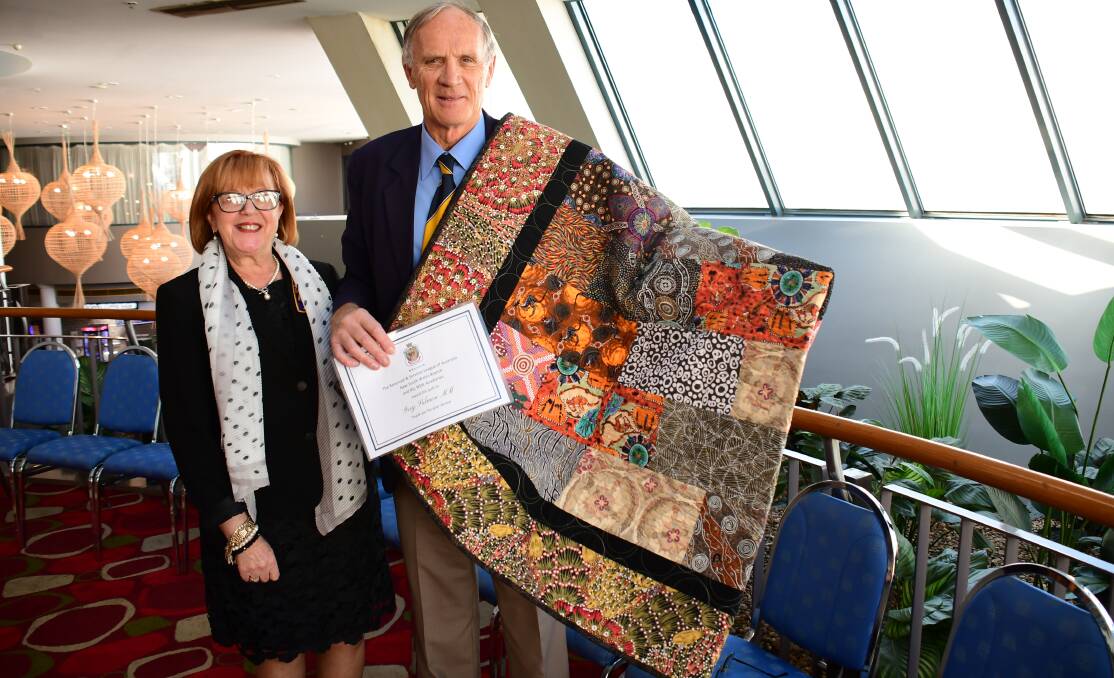 Appreciation: NSW RSL Auxiliaries state president Pauline James presents Dubbo returned serviceman Greg Salmon with the Thank You For Your Service Quilt. Photo: AMY MCINTYRE