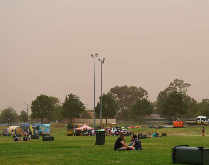 Apex Oval, the venue for the Dubbo New Year's Eve Fireworks party, on Monday as strong winds and thick clouds of dust hit. Photo: AMY MCINTYRE