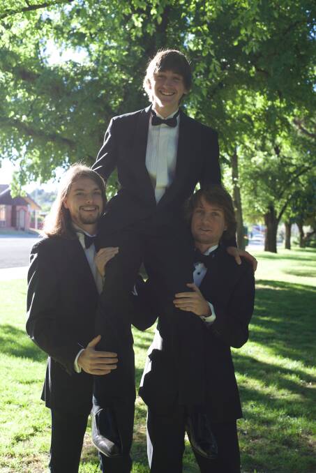 Close bonds: Reagen Skinner on the shoulders of his cousin Rhyley Wellsmore and his brother Kyle Wellsmore. Photo contributed.