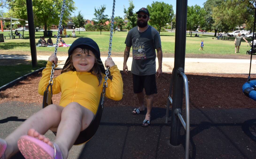 Summer schedule: Nelson Flick (right) pushes his niece Valerie Austin on the swing at Elston Park. Picture: FAYE WHEELER