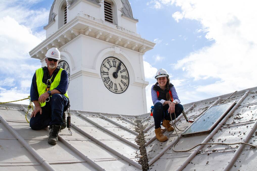 Equipped: Firefect's Glen Morgan conducts working at heights safety training for The Exchange Clock Tower owner Jillian Kilby so she can monitor the pigeon problem. Photo: Matthew Peterson.