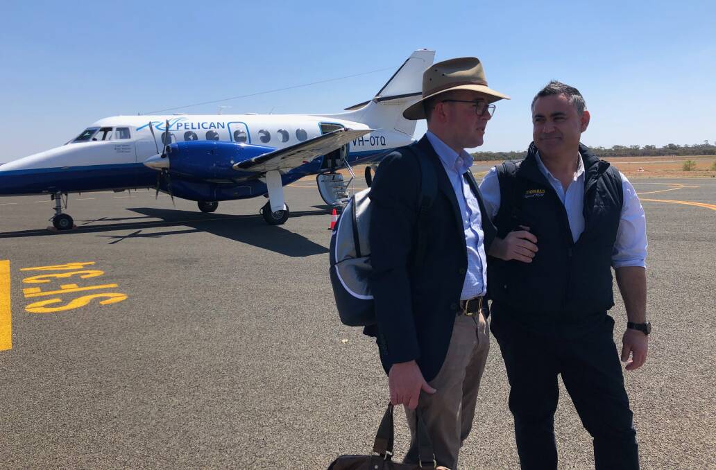 Touch down: NSW Minister for Agriculture Adam Marshall and Deputy Premier John Barilaro on the runway at Cobar. Photo contributed.