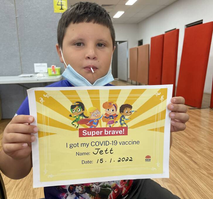 Certified bravery: Jett Stephens, 9, of Dubbo takes home a certificate for his courage coming forward to receive his first vaccination against COVID-19. Picture contributed.