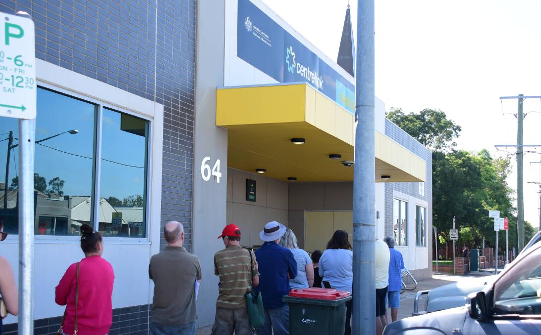 People queuing outside the Dubbo Centrelink office in the aftermath of the first round of shutdowns in response to COVID-19. 