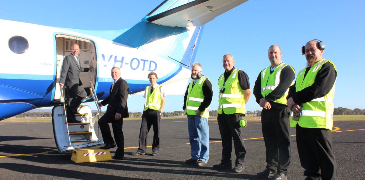 FlyPelican's Paul Graham, Mid-Western Regional Council's Brad Cam and ground crew at  the airline's Mudgee-Sydney service launch in 2015. 