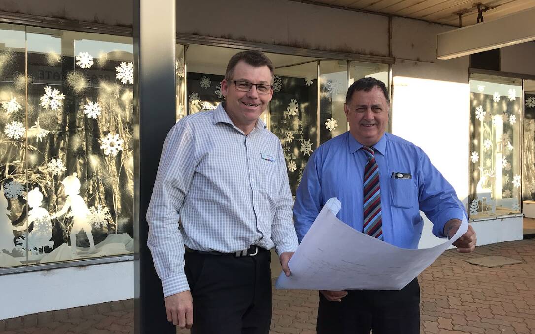 Action: Gilgandra Shire Council general manager David Neeves and Gilgandra mayor Doug Batten outside the former Target store. Photo contributed.