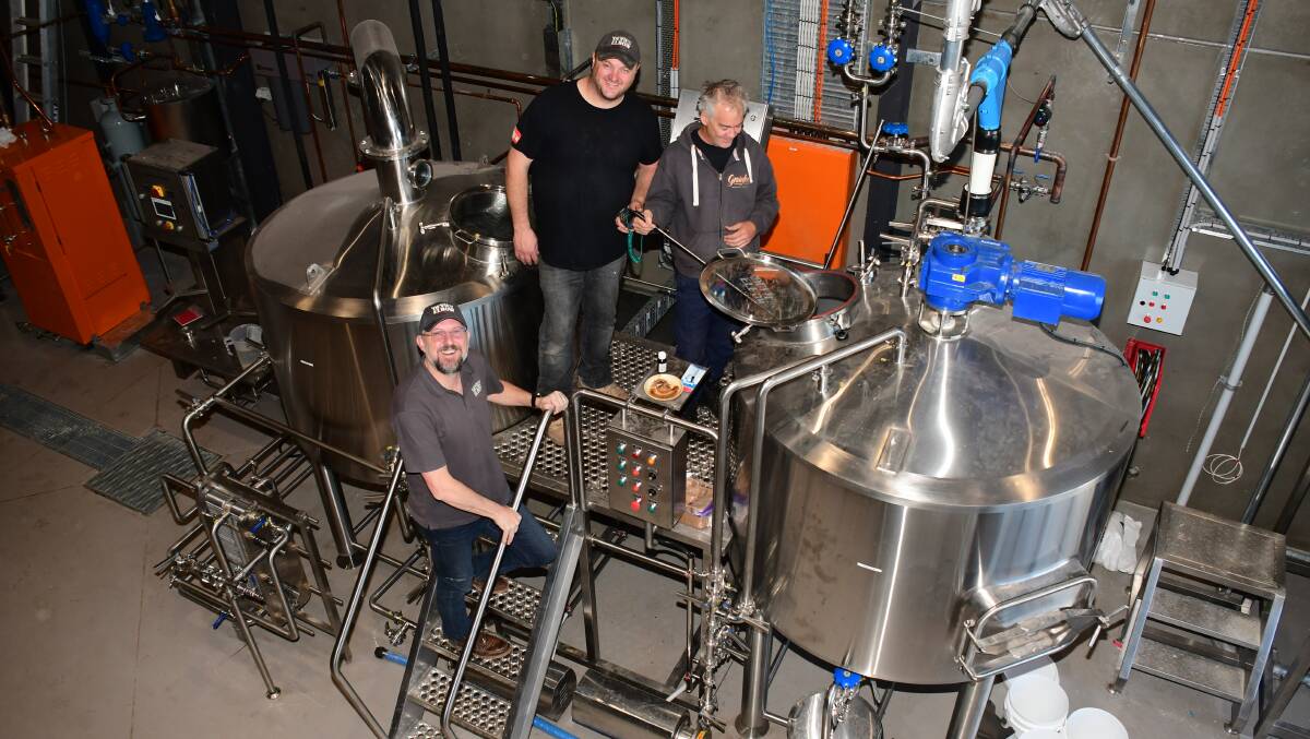 Scientific: Brewery general manager Brendon O'Sullivan, apprentice brewer Brett Comber and head brewer Lachlan MacBean test the mash. Photo: BELINDA SOOLE