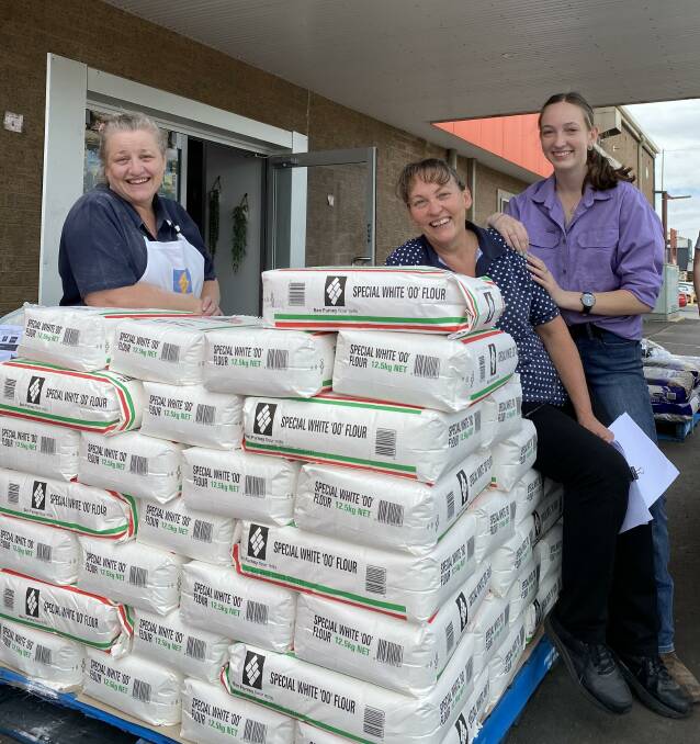 In demand: Sarah Jane Fine Foods team members Ruth Sonneman, Belinda Pengilley and Rebecca Pengilley with flour ready for customers from Dubbo and locations across NSW. Photo contributed.