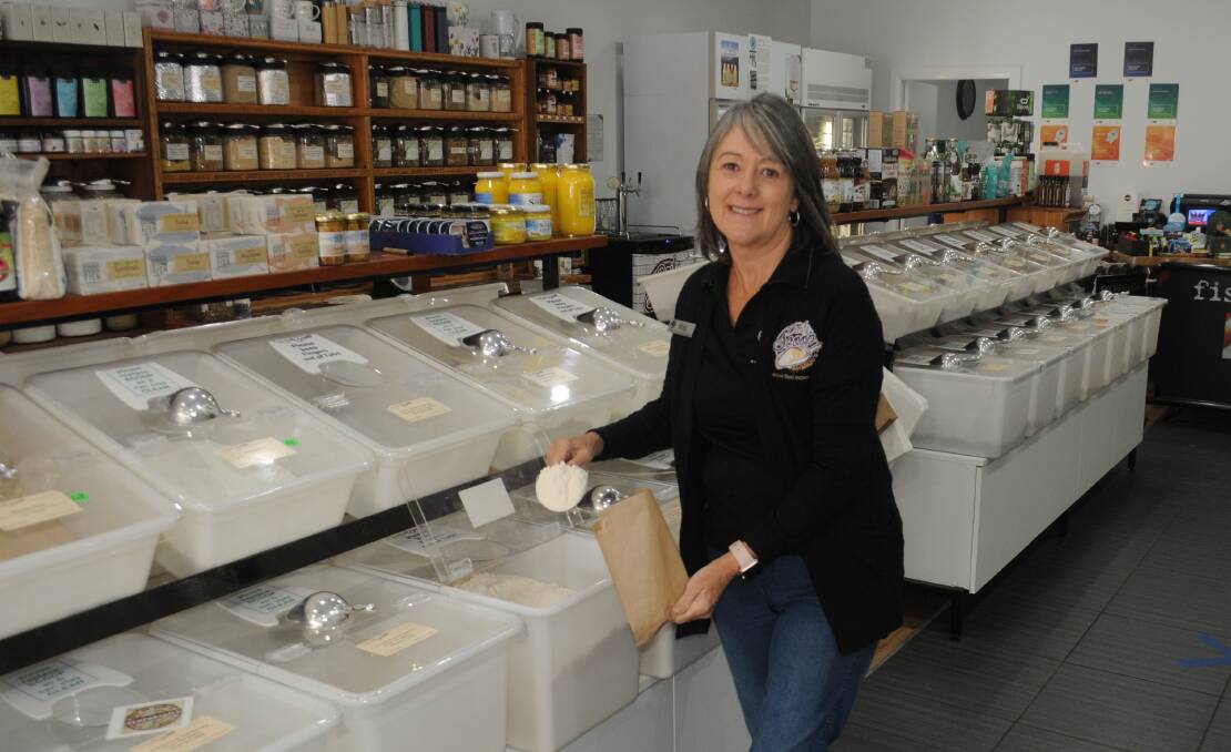 Pantry staple: Daily Scoop at Majo's owner Jo Campbell serves out flour, a product in demand as the coronavirus pandemic prompts more baking and cooking at home. Photo: FAYE WHEELER