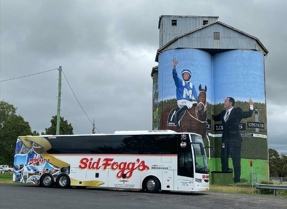 A Sid Fogg's coach stopping at Dunedoo on its way between Dubbo and Newcastle in April. The service has been temporarily paused from this week. Picture: Sid Foggs/ Facebook