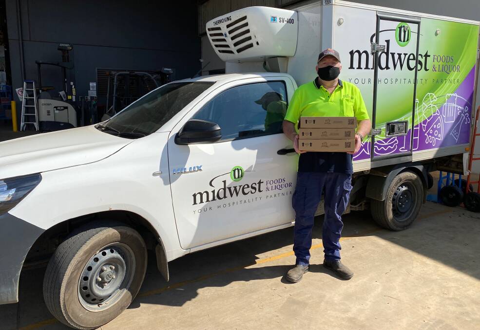 IN DEMAND: Midwest Foods delivery driver Paul Patterson keeps supplies up to customers during the region's COVID challenge. Photo contributed.