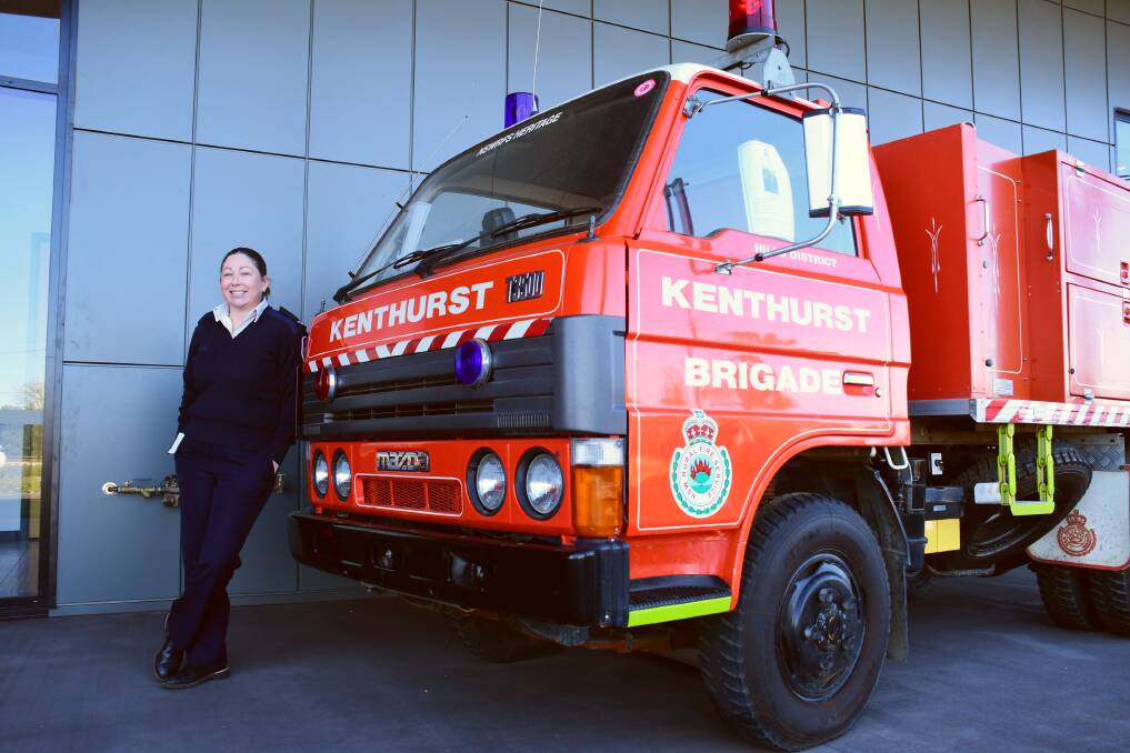 Fulfilling: NSW Rural Fire Service operations officer in operational capability Corinne Iliesvki with a vintage truck on display at her new workplace, the NSW RFS Training Academy at Dubbo. Photo: AMY MCINTYRE 
