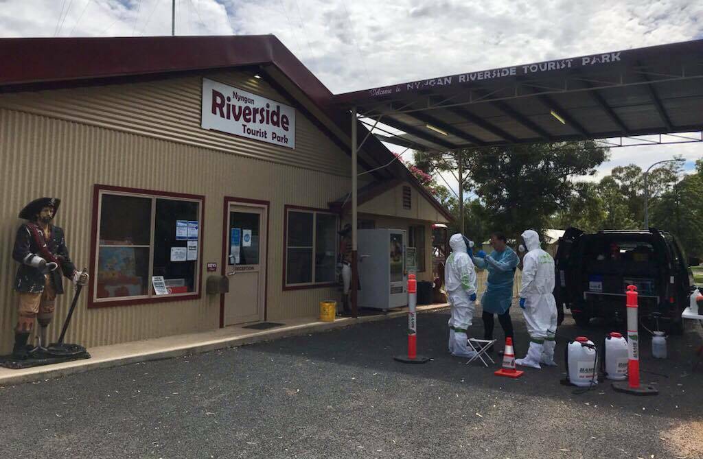 Pulling out all stops: A specialist cleaning team from Sydney goes to work at the Nyngan Riverside Tourist Park last week after it was visited by a Berala man who later tested positive to COVID-19. Photo: Nyngan Riverside Tourist Park/ Facebook. 