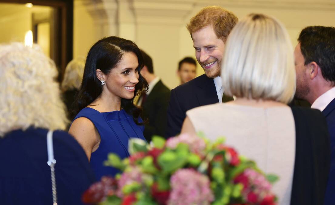 Visit: Prince Harry, centre right and Meghan, the Duchess of Sussex earlier this month at '100 Days to Peace'. Photo: Geoff Pugh/Pool Photo via AP