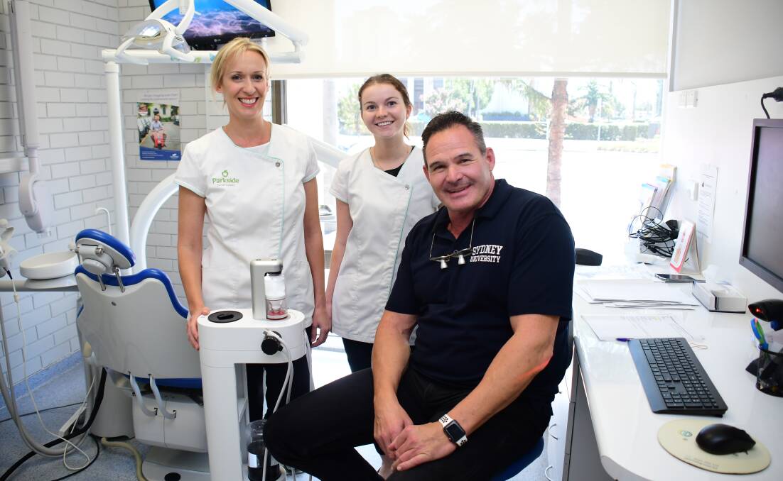 Specialist care: Dental hygienist Jennie Tylee-Porter, dental assistant Hope Pressler and periodontist Professor Axel Spahr at the Dubbo clinic. Photo: AMY MCINTYRE