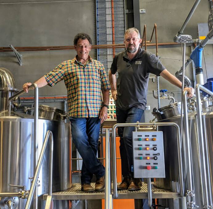 In the thick of the action: Sydney Weekender host Mike Whitney takes a tour of the brewhouse with Devil's Elbow Brewery general manager Brendon O'Sullivan. Photo contributed.
