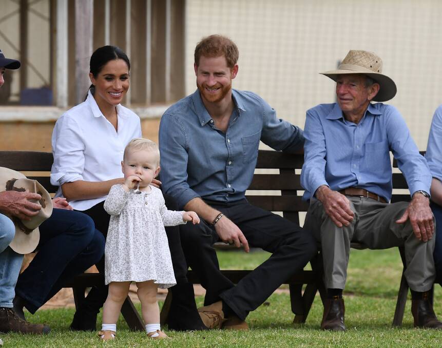 Sweet: The Duke and Duchess of Sussex appear besotted by 13-month-old Ruby Carroll, daughter of Emily and Jake Carroll near Dubbo. Photo: DEAN LEWIS / AAP.
