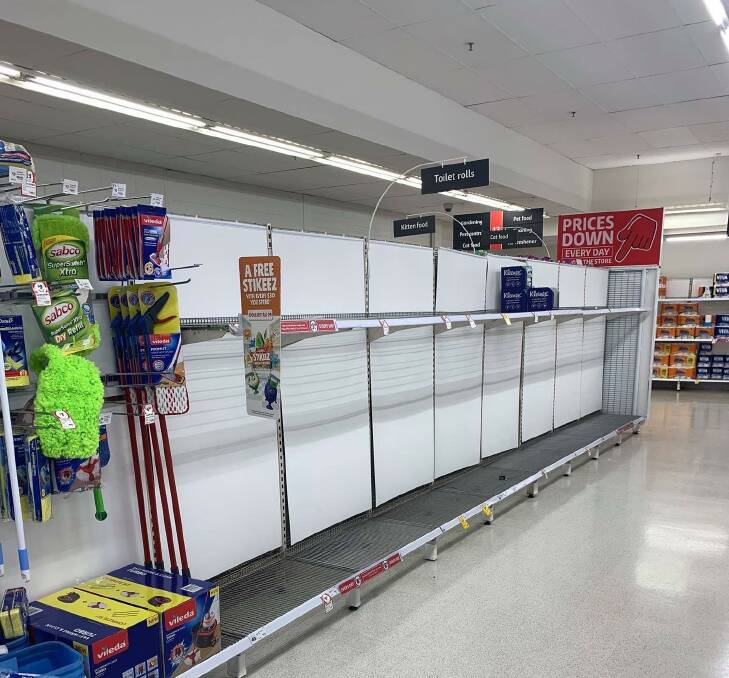 Gone: Coles shelves stripped of toilet paper last week. Similar scenes greeted customers on Sunday. Photo contributed.