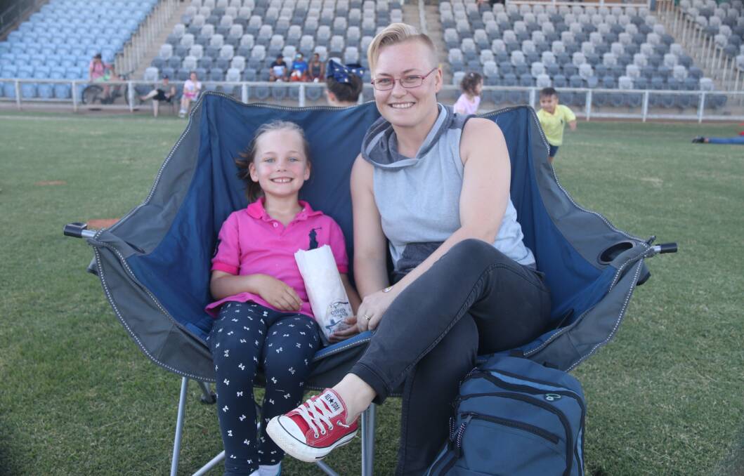 Movie time: Maddie and Jess Macdonald of Dubbo at Newcastle Permanent's Cinema Under the Stars, which will return to Apex Oval on Valentine's Day next year. File photo.