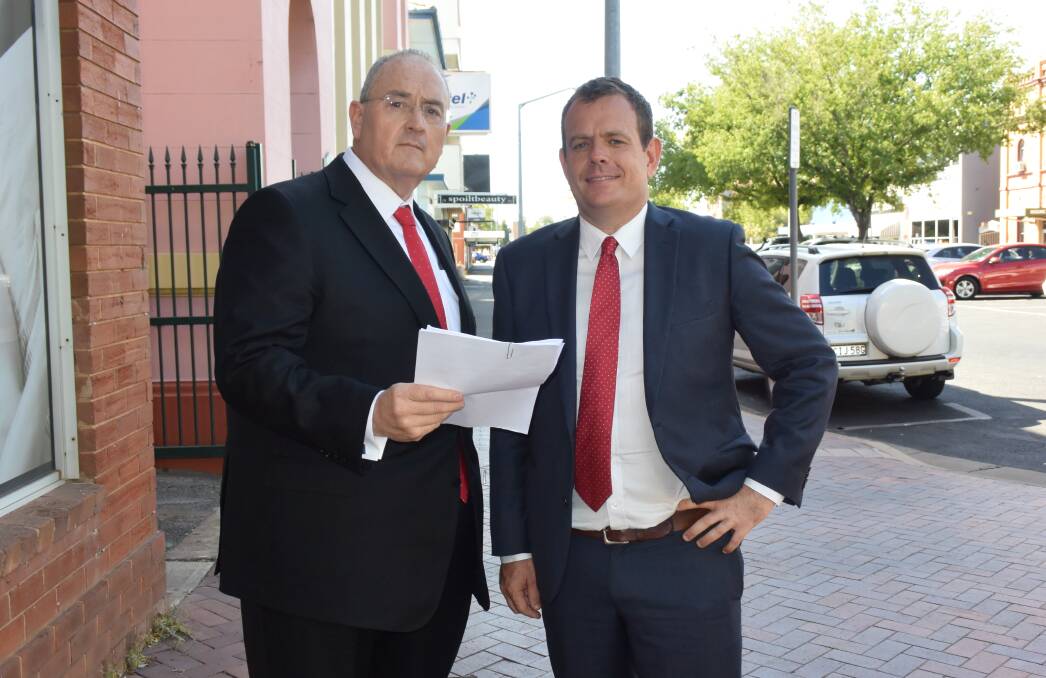Opposition health spokesman Walt Secord and Country Labor candidate Stephen Lawrence in Dubbo on Friday. 